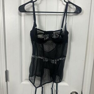 Black sheer boned Victoria's Secret corset with garter straps. M